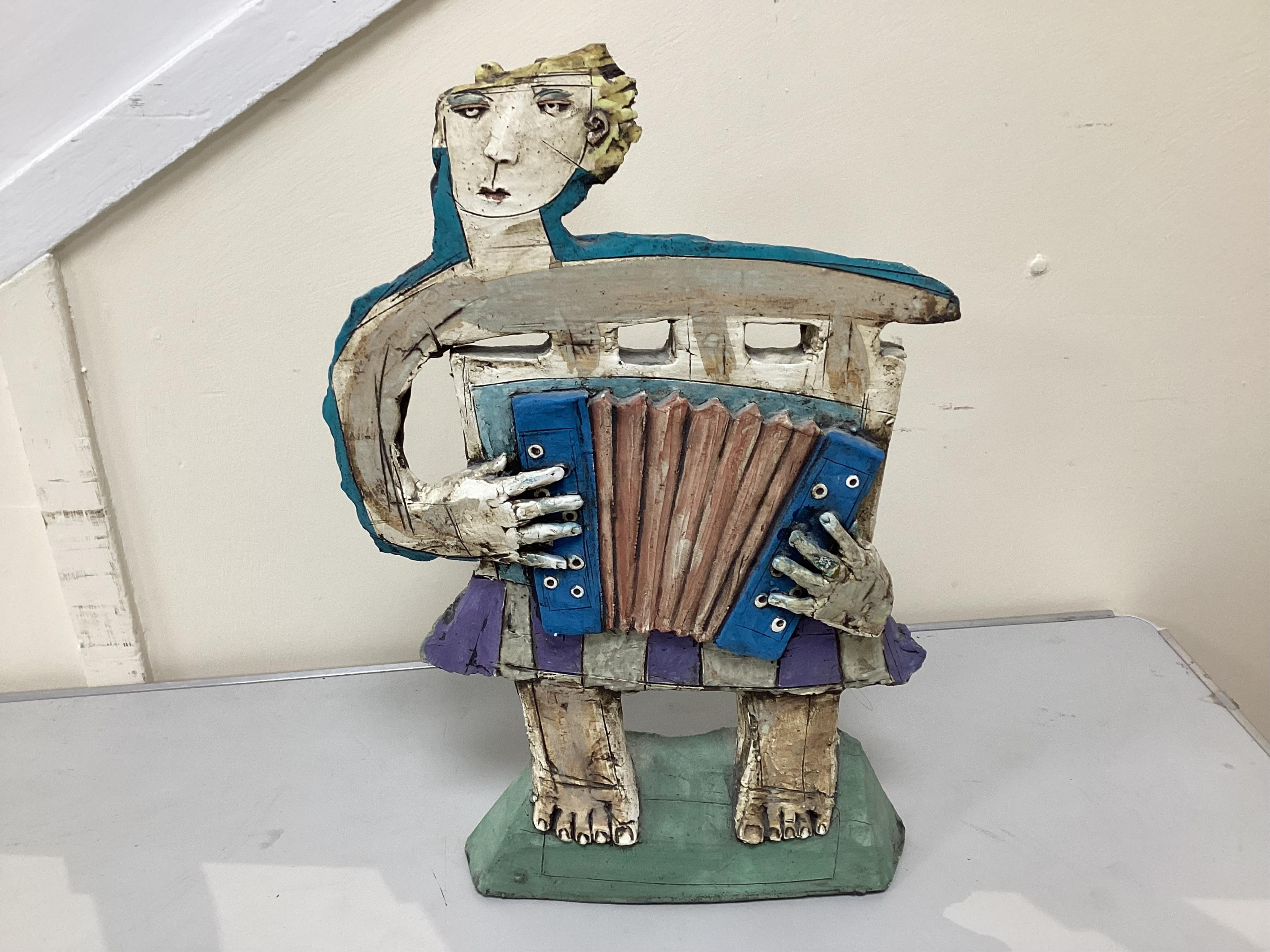 Christy Keeney (b.1958) Figure of a accordian player, 42.5cm high